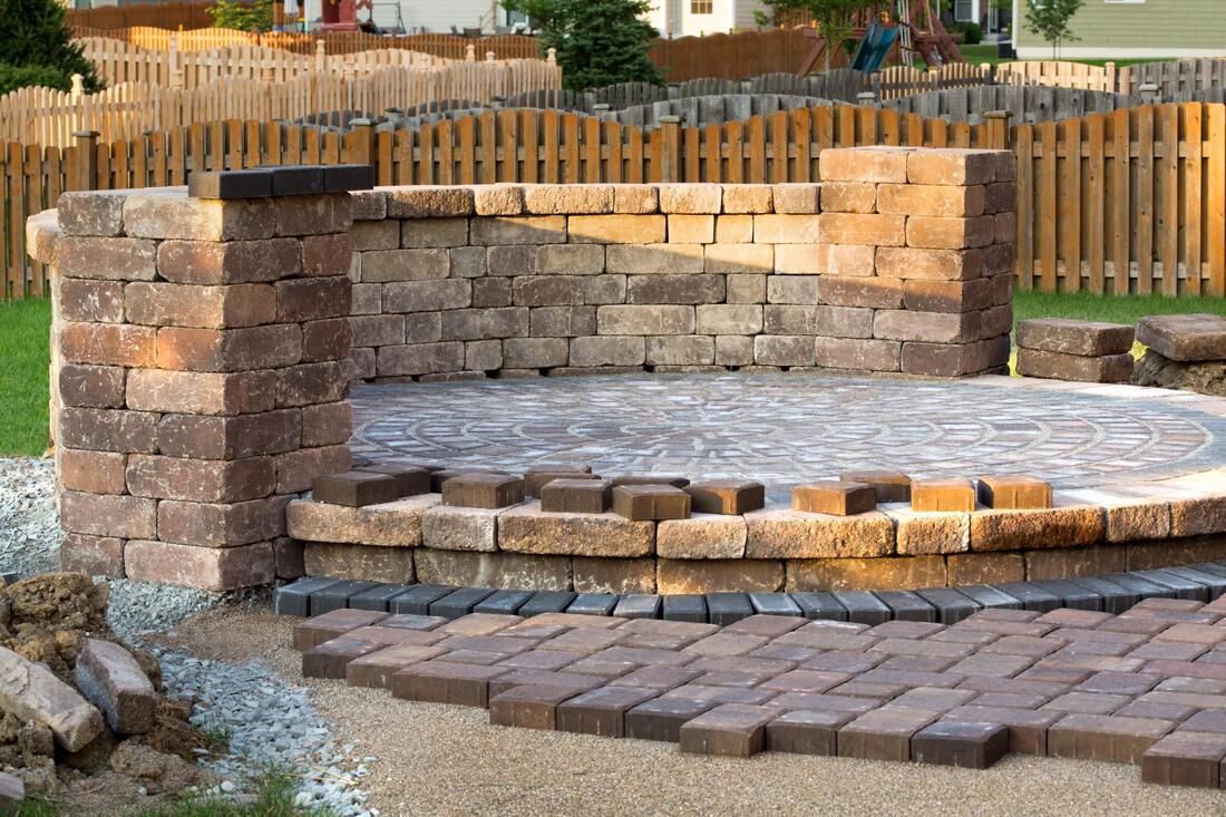 a brick patio pavement with design