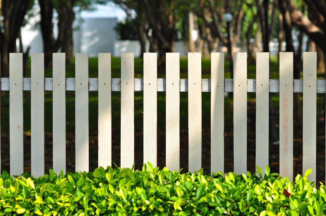 white bar type fence
